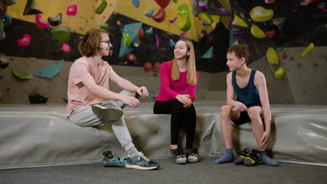 teenage friends in a climbing gym