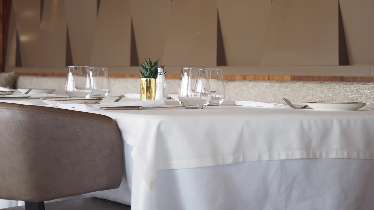 An elegantly set dining table in a restaurant