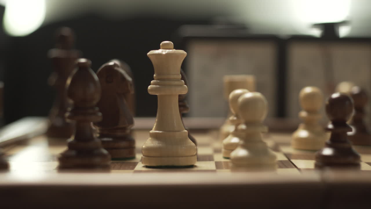 Panoramic movement in chessgame, female hand moves queen from C2 to C6, cinematic lights and shallow depth of field
