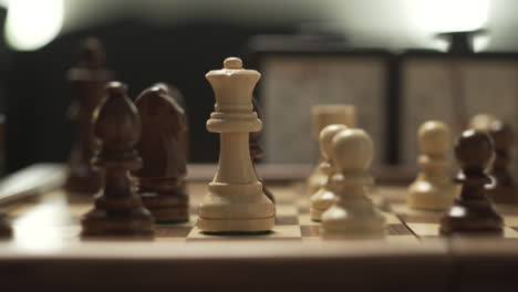 panoramic movement in chessgame, female hand moves queen from c2 to c6, cinematic lights and shallow depth of field