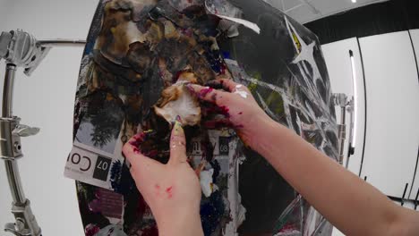 artist creating giant abstract painting in studio. hands covered in paint. mixed media techniques. slow motion, fisheye clip. creative process, dynamic strokes, modern art, contemporary painting