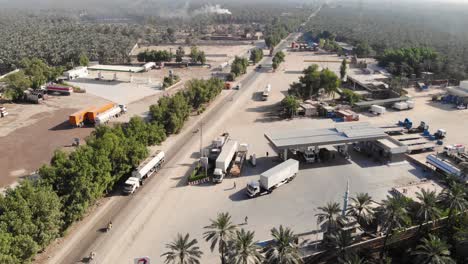 Aerial-View-Of-Fuel-Gas-Station-Beside-Road-In-Khairpur