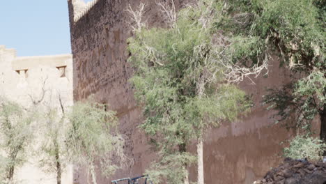 Jabreen-Castle-battlements,-Oman,-wide-shot-tilt-down