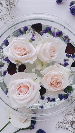 delicate floral arrangement in glass bowl