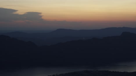 panoramic aerial hyperlapse sunset lake bourget france aix les bains landscape alpine mountains over gradient orange golden pink skyline