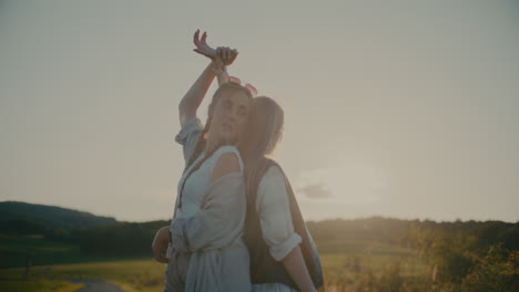 female friends holding hands while standing together