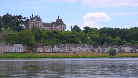 a beautiful chateau stands along the loire river in france