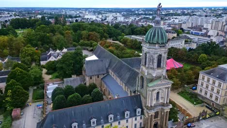 approaching movement towards the abbey church of notre-dame-en-saint-melaine with thabor park, rennes, france