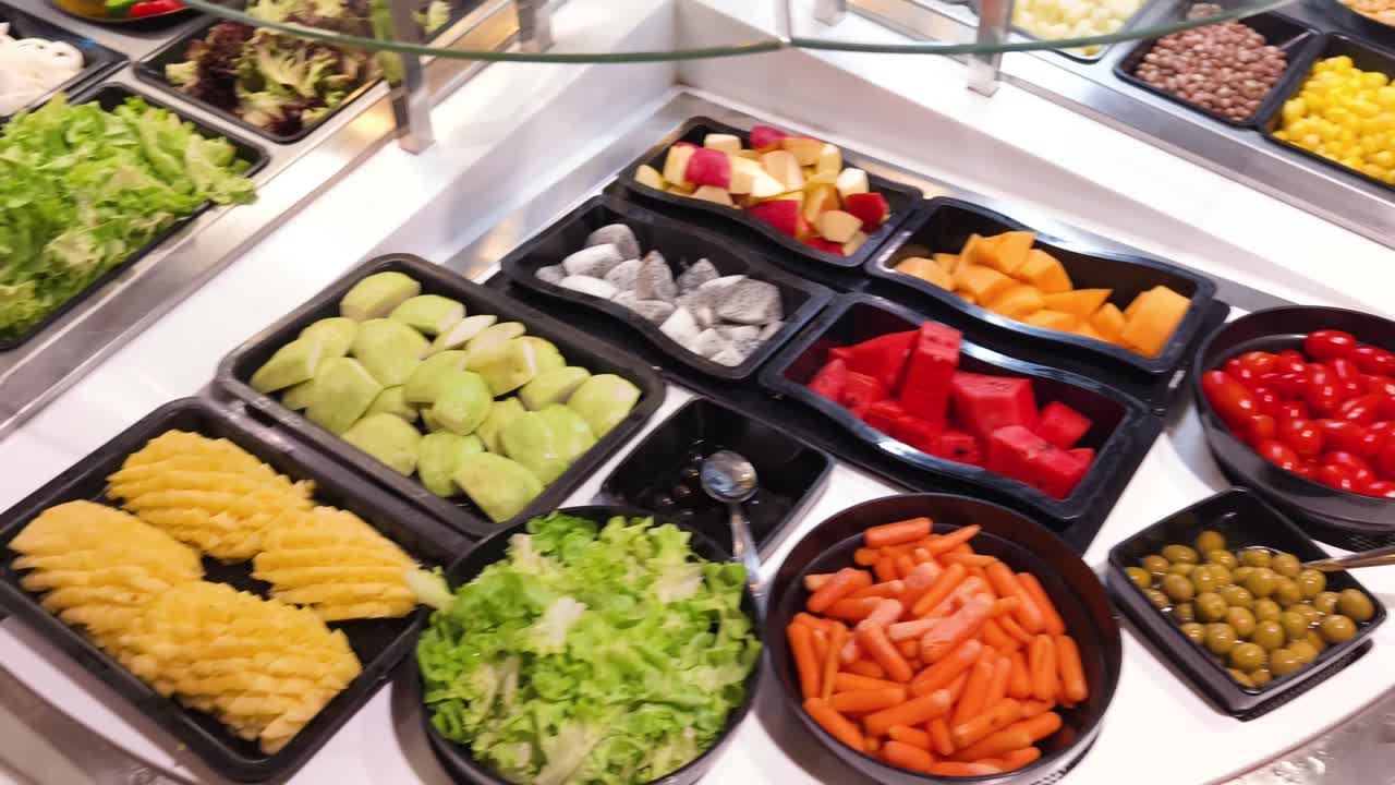 Self-Service Salad Bar with Fresh Fruits and Vegetables