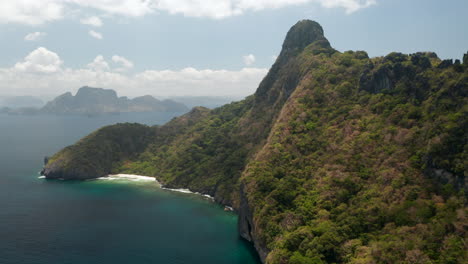 Aerial-showing-tropical-Island-from-above-with-aqua-water-and-green-trees