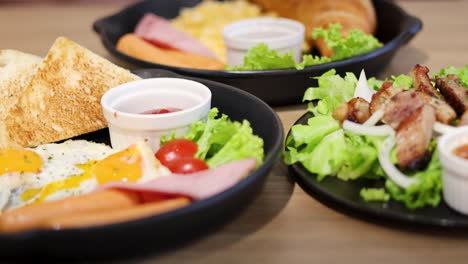 eggs, toast, salad, and meat on a plate