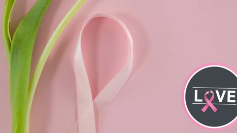animación de texto de concienciación sobre el cáncer de mama sobre una flor y una cinta rosa de cáncer de mama