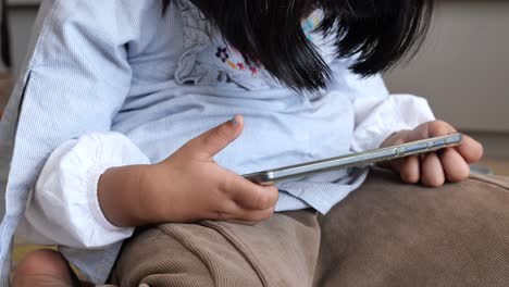 child playing with smartphone