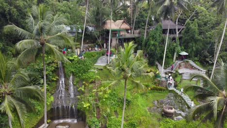 Tourists-enjoying-Activities-in-tropical-Rainforest-amid-Palm-Trees,-Waterfall,-Rice-terraces-in-Alas-Harum-Ubud,-Bali