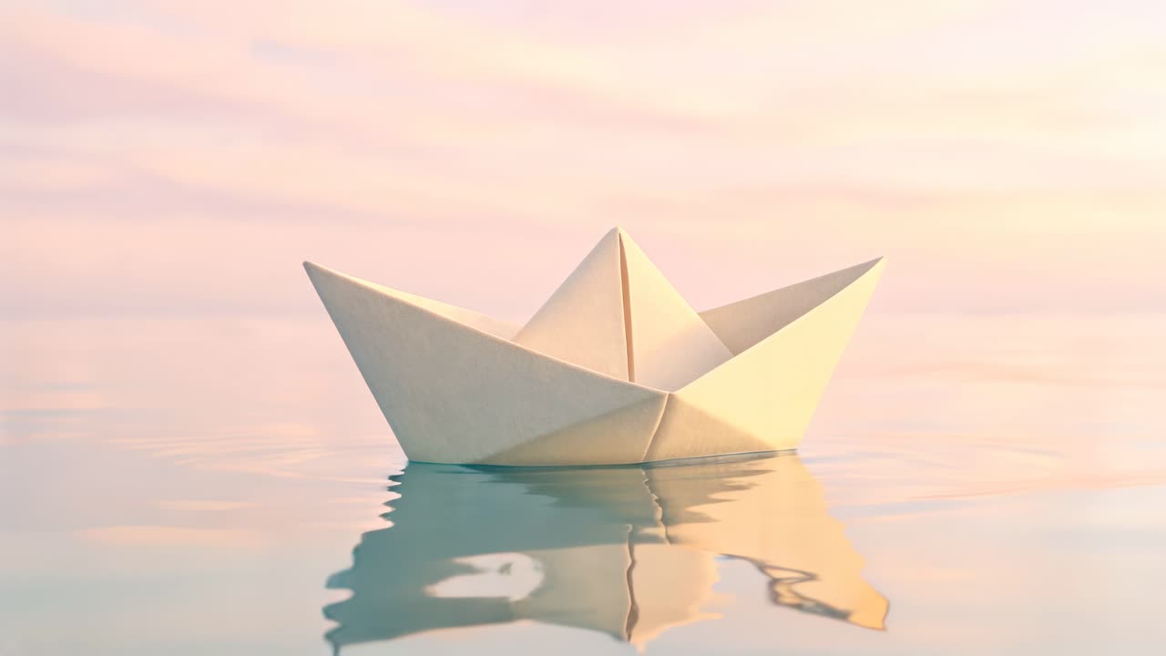 A serene video scene of a paper boat floating on calm water at sunset