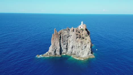 Strombolicchio-Small-Volcano-Island-Rock-near-Stromboli-at-Aeolian-Islands,-Sicily,-Italy---Aerial-4k