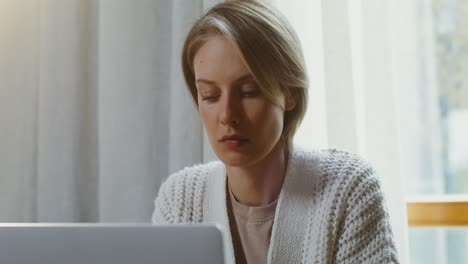 woman working on laptop at home