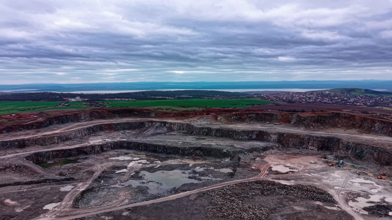 Quarry site for granite extraction in an industrial setting during daytime