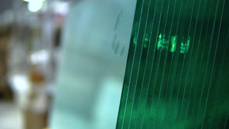 close up of stacked glass panes. pan down