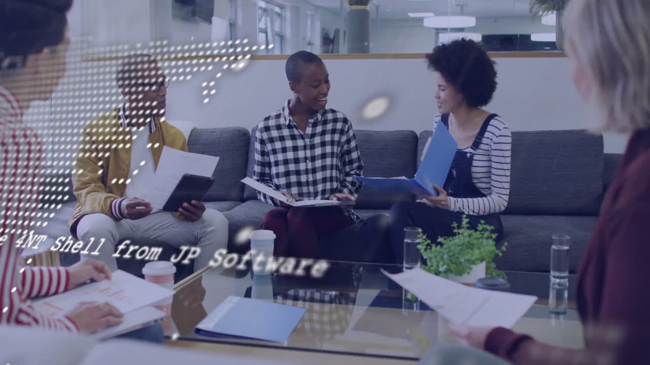 Diverse team discussing documents in office with digital data overlay animation