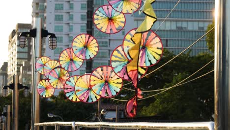 vibrant windmills spinning against a city backdrop