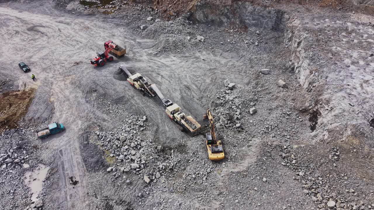 Aerial View of Heavy Machinery Working in a Stone Quarry