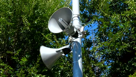 loudspeakers fitted to make announcements on the street pole.