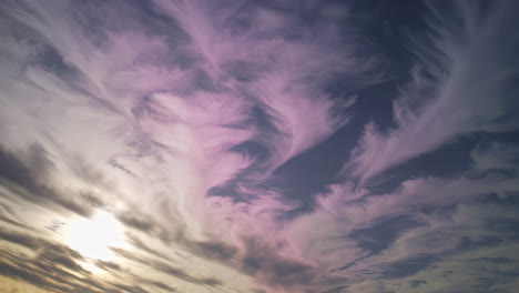 dreamy sky with colorful wispy clouds at sunset