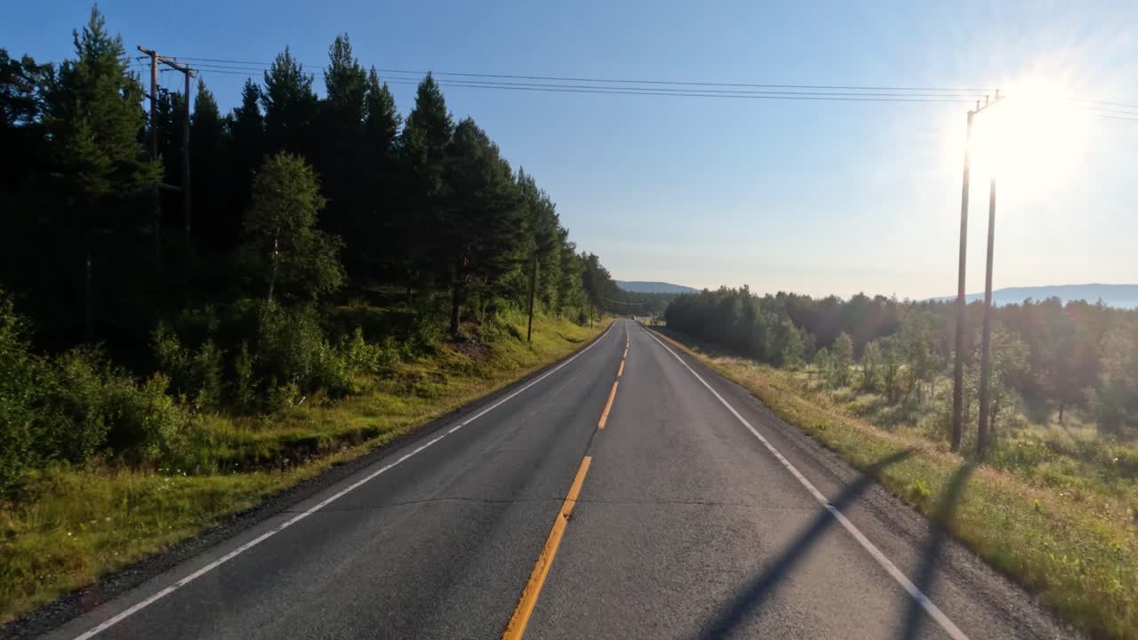 Driving a Car on a Road in Norway.