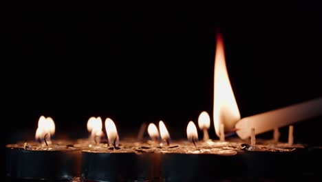 Background-of-tea-cup-glitter-Candles-Lights-shines-yellow-gold-bright-for-celebration,-religion,-anniversary-Festival