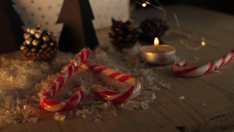 candy cane love heart and christmas decorations in warm candle scene medium zoom out shot