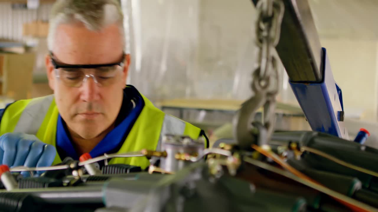 Engineer repairing aircraft engine 4k