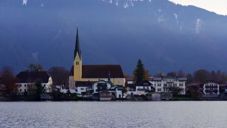 close up view of a church across the waters of tegernsee