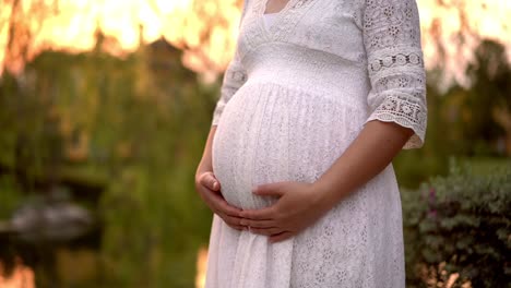 Pregnant-woman-feeling-happy-at-garden-home.