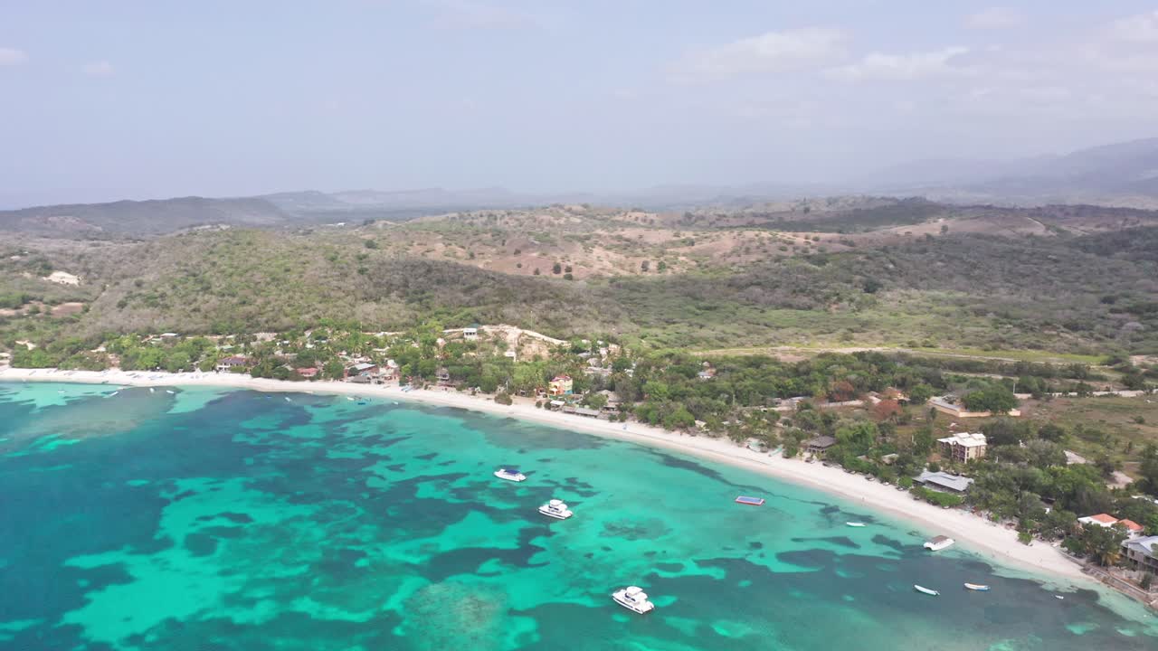 High elevation aerial of idyllic Playa La Ensenada tropical beach and ocean