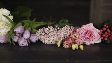 Panorama-footage-of-a-variety-of-beautiful-flowers-of-different-colors-and-types.-Indoors