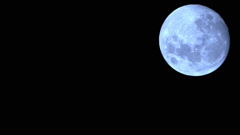 large full moon during astronomical moonset, illuminating in night sky