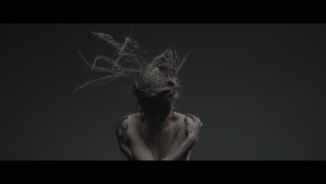 a woman dressed as mother nature rise her head