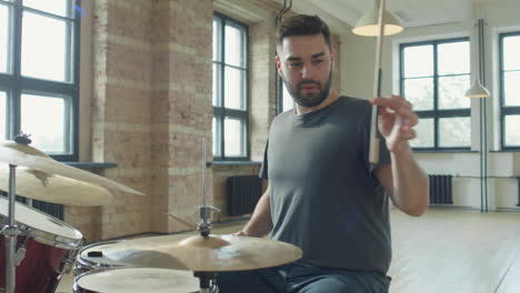 music teacher giving online drum lesson