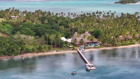 aerial reveal of paradise tropical island vanua levu, travel destination with resort and coastline.