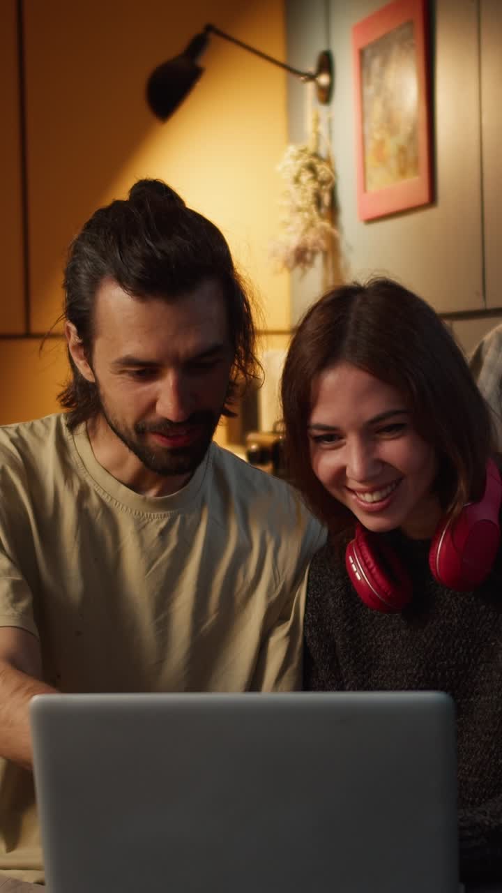 Couple Watching Laptop Together at Home