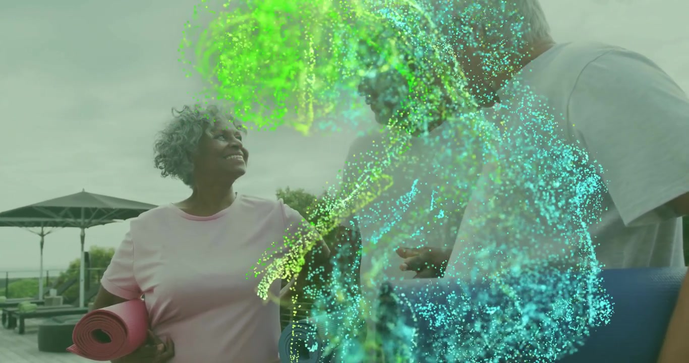 Fitness group holding mats on deck as glowing green cyan particles appearing, swirling around them