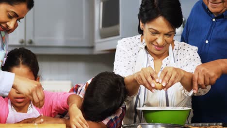 Happy-family-preparing-cookies-in-kitchen-4k