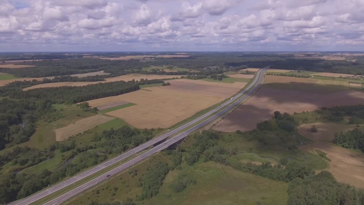 The Baltic Way Highway on a Cloudy Summer Day. Aerial Slow Panning Left