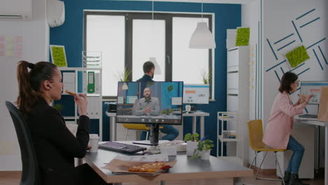 businesswoman having delivery takeaway lunch meal order during takeout lunchtime at desk