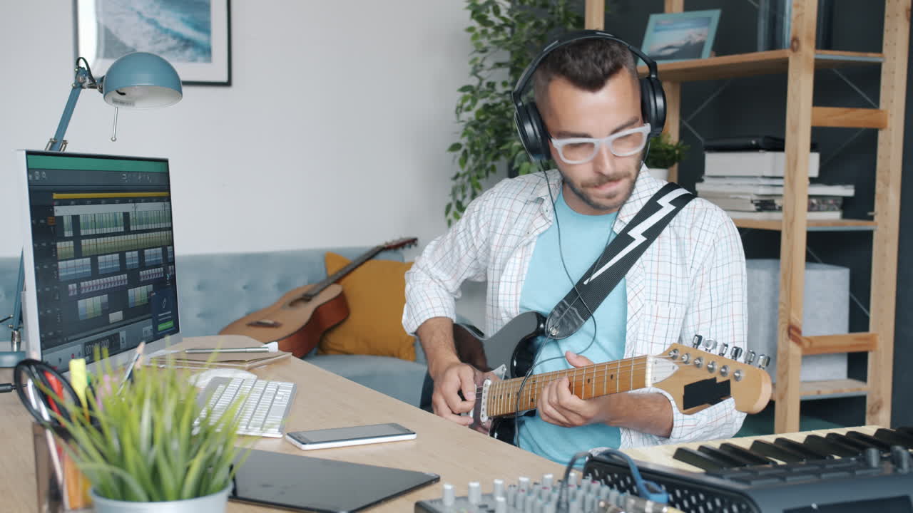 Musician Playing Electric Guitar in Home Studio
