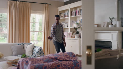 happy-african-american-man-dancing-at-home-celebrating-success-having-fun-crazy-dance-in-living-room-enjoying-lifestyle-freedom-on-weekend-4k