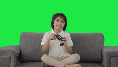 Happy-Indian-boy-playing-video-games-Green-screen