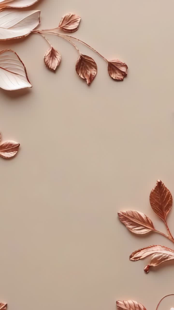 Vertical video: Opening camera on beige tabletop, highlighting metal leaf clusters and branches