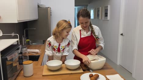 mother and daughter baking together